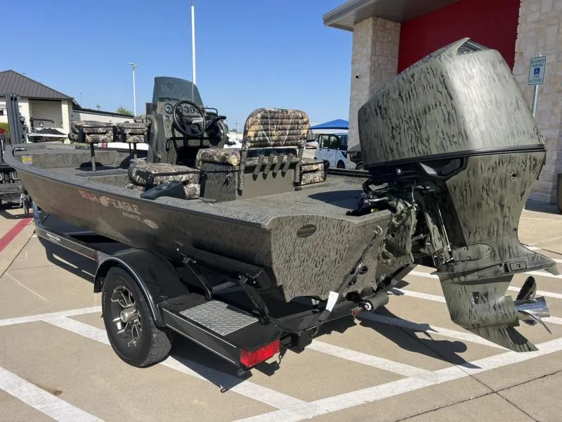 Slide: The Image of 2025 War Eagle 961 Blackhawk boat with camouflage design and powerful outboard motor. - 3