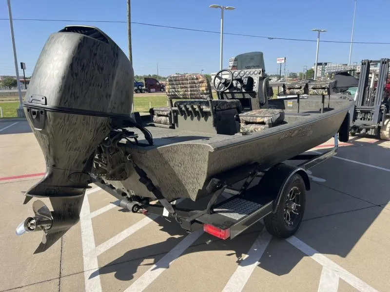 Slide: The Image of 2025 War Eagle 961 Blackhawk boat on trailer, featuring camouflage design and powerful outboard motor. - 5