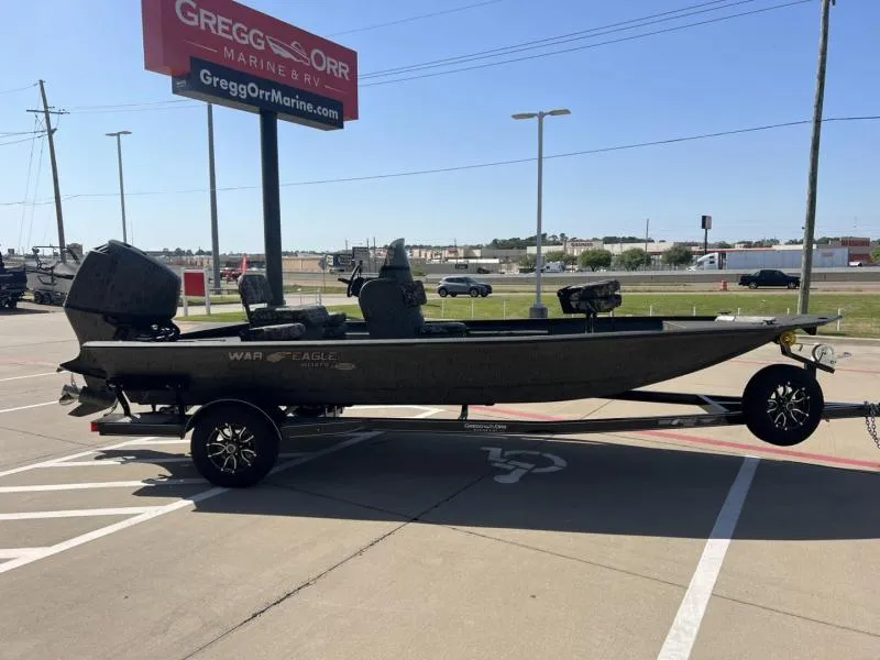 Slide: The Image of 2025 War Eagle 961 Blackhawk boat on trailer at Gregg Orr Marine dealership. - 6