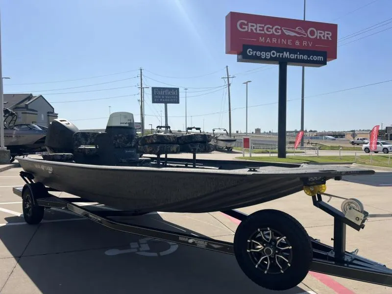 Slide: The Image of 2025 War Eagle 961 Blackhawk boat on trailer at Gregg Orr Marine dealership. - 7