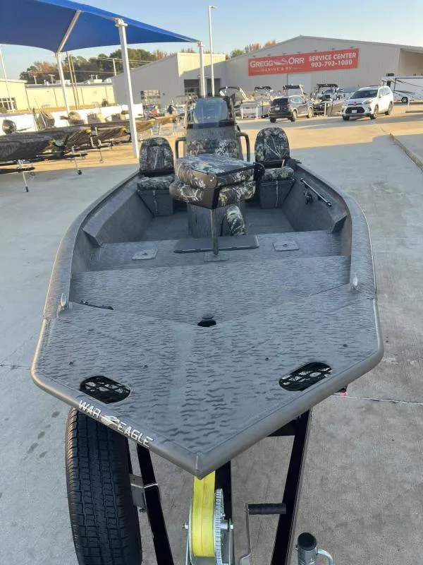Slide: The Image of 2025 War Eagle 961 Blackhawk boat on display at dealership. - 8