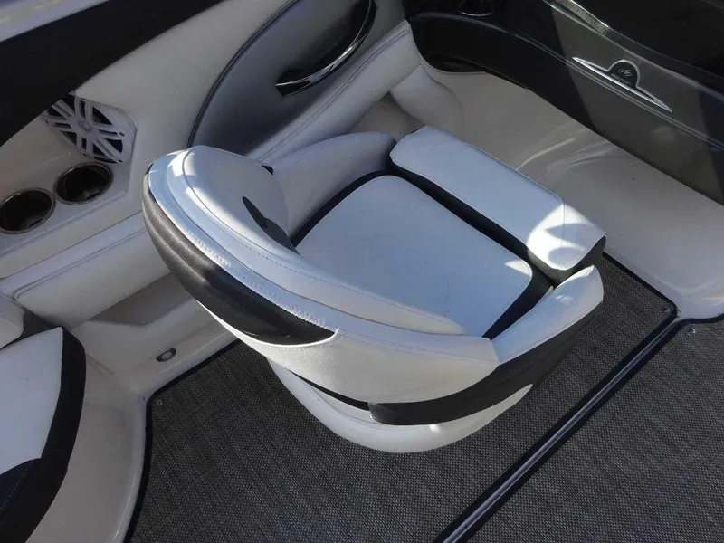 Slide: The Image of 2021 Monterey 224FS boat interior with sleek white and black seating. - 10