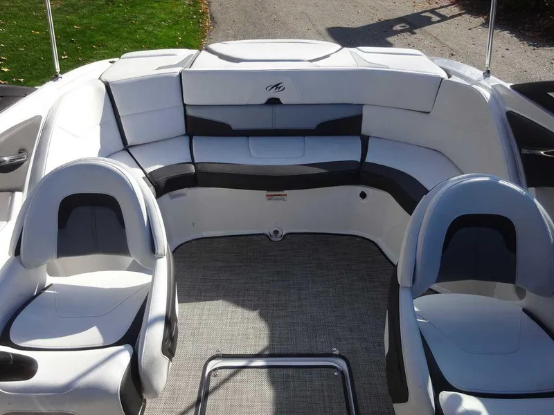 Slide: The Image of 2021 Monterey 224FS boat interior with white and gray seating. - 18