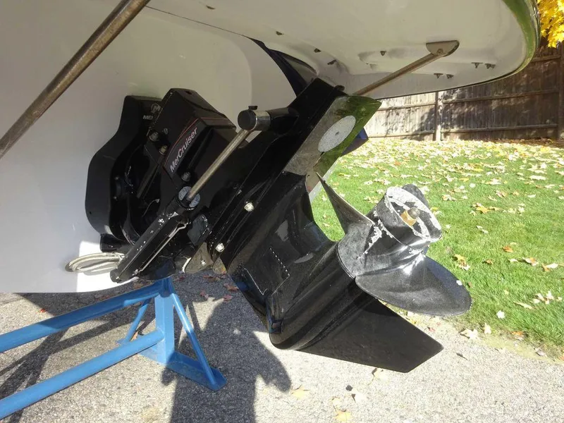 Slide: The Image of 2021 Monterey 224FS boat outdrive on stand, showcasing propeller and mechanism. - 21