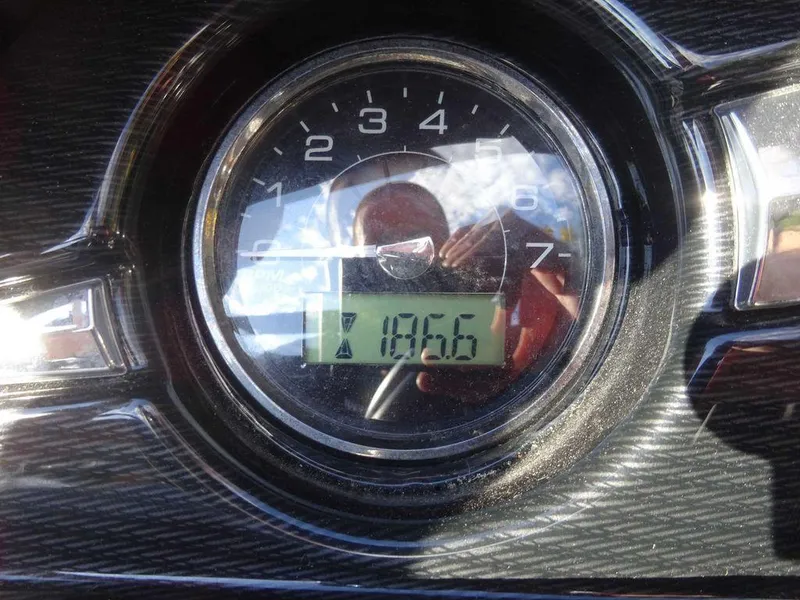 Slide: The Image of Close-up of 2021 Monterey 224FS boat tachometer displaying 185.6 hours. - 22