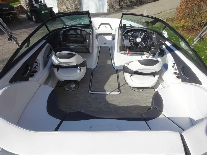 Slide: The Image of 2021 Monterey 224FS boat interior with seating and steering wheel. - 6