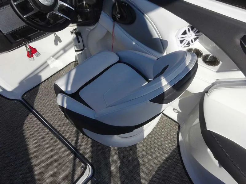 Slide: The Image of 2021 Monterey 224FS boat interior with swivel seat and modern dashboard. - 7