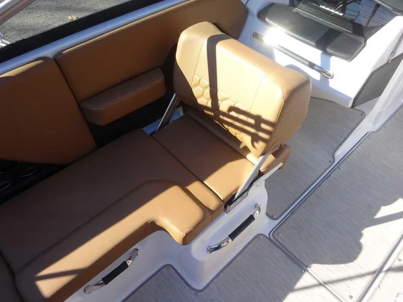 Slide: The Image of 2023 Four Winns H2 Sterndrive boat interior with tan leather seating. - 11