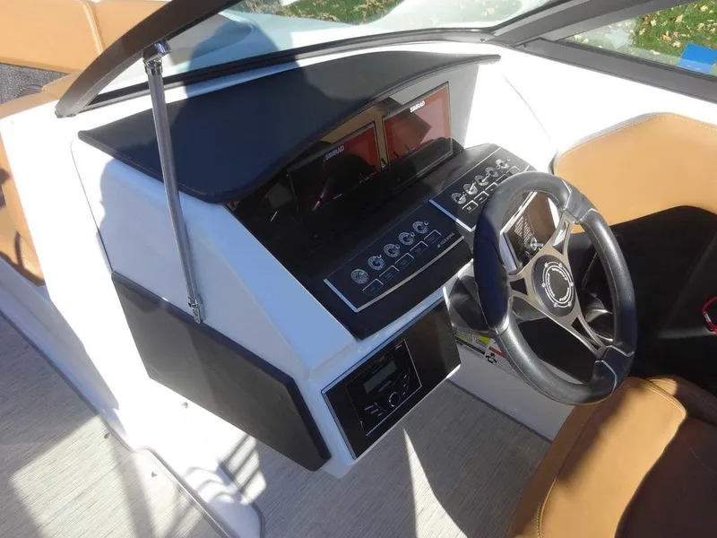 Slide: The Image of 2023 Four Winns H2 Sterndrive dashboard with modern controls and steering wheel. - 13