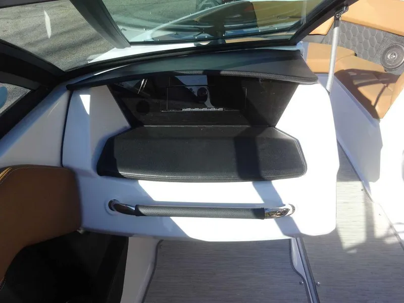 Slide: The Image of 2023 Four Winns H2 Sterndrive boat interior with sleek dashboard and modern design. - 15