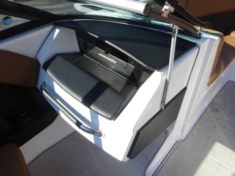 Slide: The Image of 2023 Four Winns H2 Sterndrive boat interior with sleek black and white dashboard design. - 16