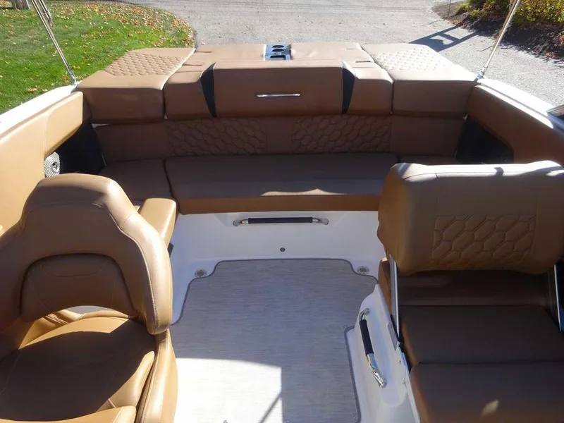 Slide: The Image of 2023 Four Winns H2 Sterndrive boat interior with brown leather seating. - 18