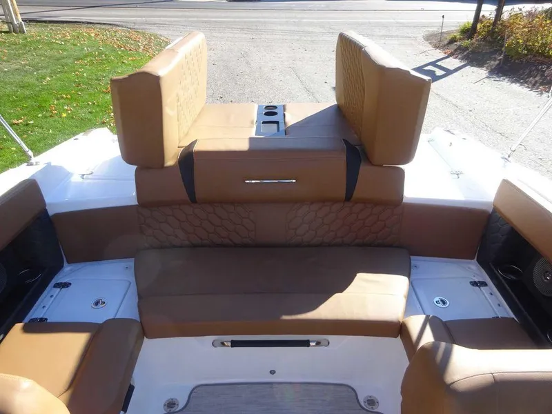 Slide: The Image of 2023 Four Winns H2 Sterndrive boat interior with tan leather seating. - 19