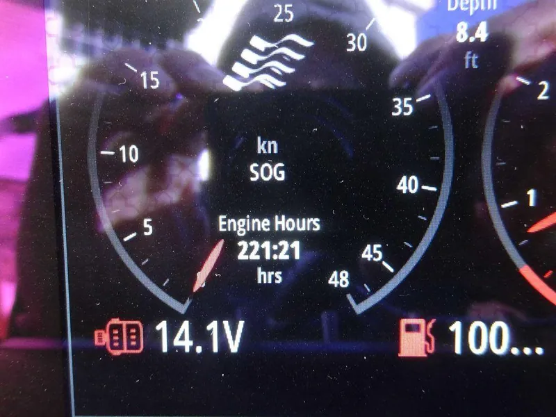 Slide: The Image of Dashboard of 2023 Four Winns H2 Sterndrive showing 221 engine hours. - 22