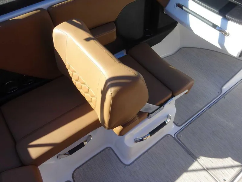 Slide: The Image of 2023 Four Winns H2 Sterndrive boat interior with tan leather seating. - 9