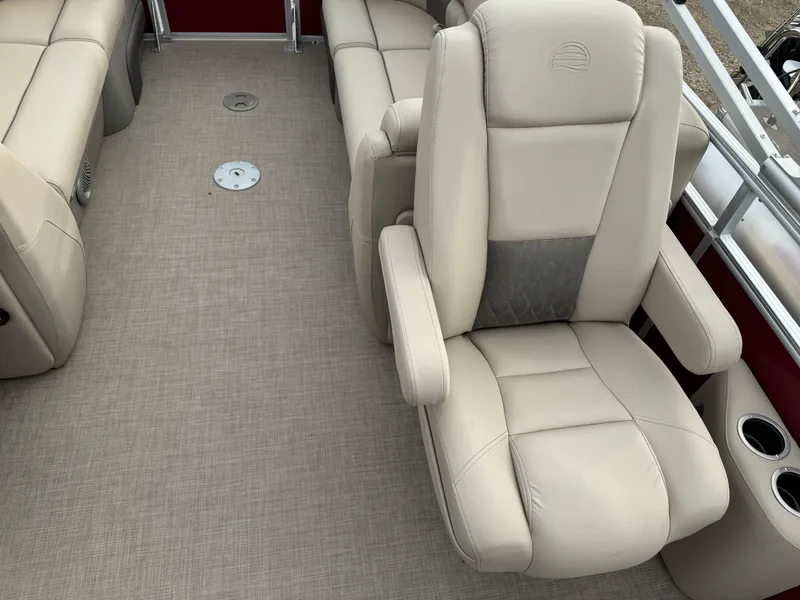 Slide: The Image of 2022 Sun Tracker Party Barge 22 XP3 interior with beige seating and carpet. - 12