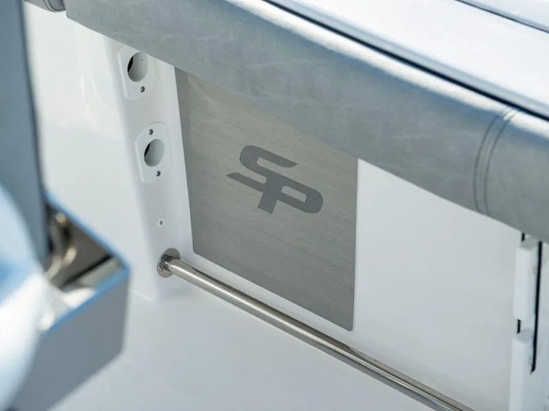 Slide: The Image of 2025 Sea Pro 242 DLX boat interior detail with SP logo and sleek design. - 12