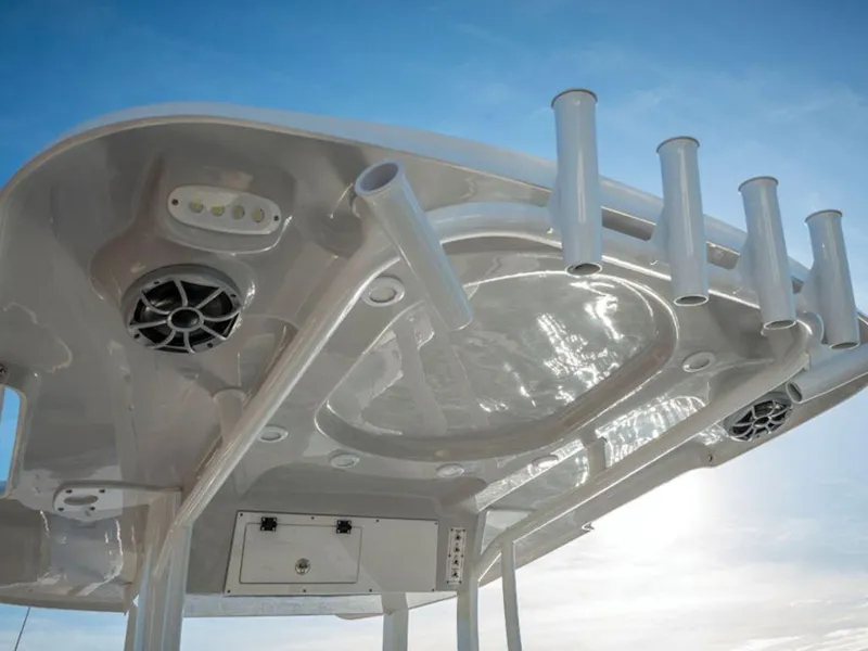 Slide: The Image of 2025 Sea Pro 242 DLX boat top view with rod holders and speakers. - 7