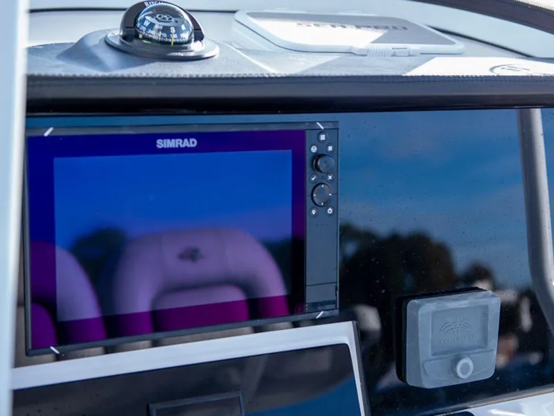 Slide: The Image of Dashboard of 2025 Sea Pro 242 DLX boat with Simrad display and compass. - 9
