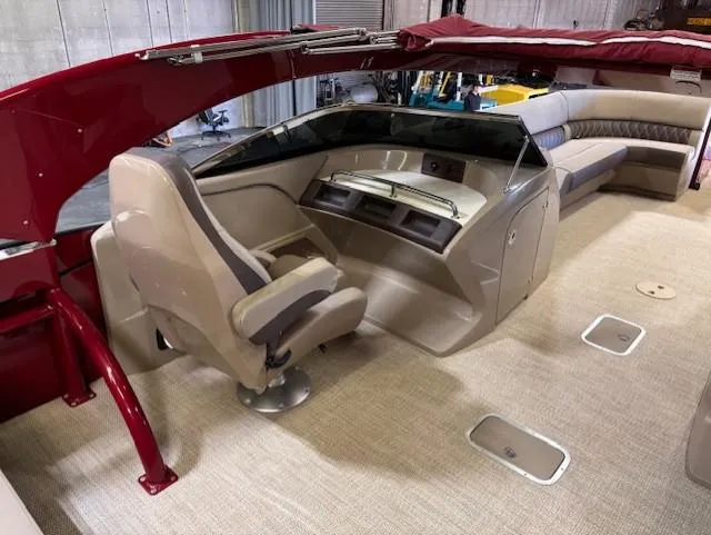Slide: The Image of 2021 Bennington QX 30 QXSBWA X2 boat interior with helm and seating area. - 11