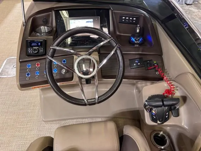 Slide: The Image of 2021 Bennington QX 30 QXSBWA X2 boat dashboard with steering wheel and controls. - 13