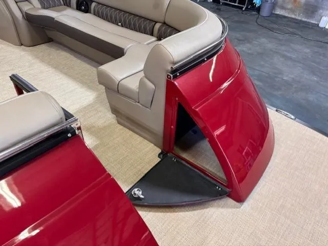Slide: The Image of 2021 Bennington QX 30 QXSBWA X2 boat interior with red panel and beige seating. - 17