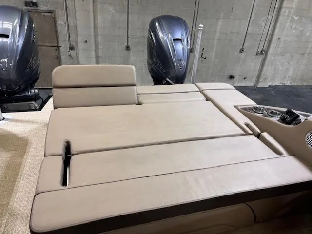 Slide: The Image of 2021 Bennington QX 30 QXSBWA X2 boat interior with beige seating and dual engines. - 9