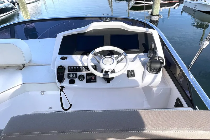 Slide: The Image of Flybridge helm of 2024 Sessa Marine F42, featuring modern controls and navigation equipment. - 16