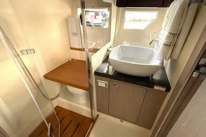 Slide: The Image of 2024 Sessa Marine F42 Flybridge bathroom with modern sink and shower. - 5