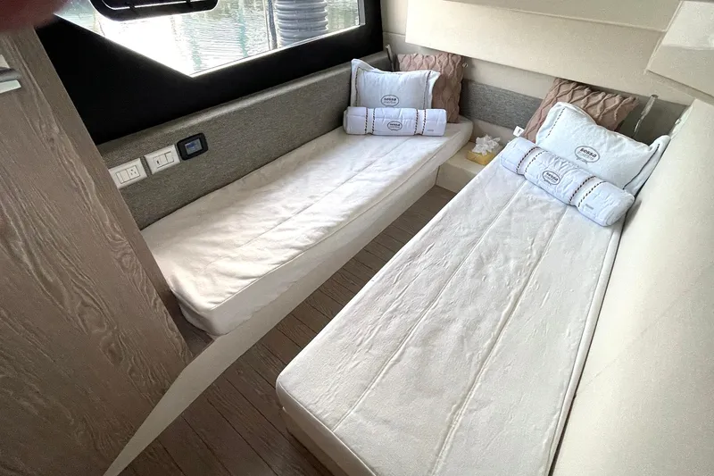 Slide: The Image of Interior of 2024 Sessa Marine F42 Flybridge with twin beds and modern design. - 6
