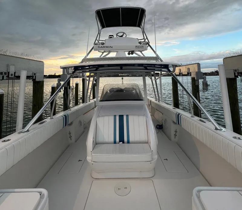 Slide: The Image of 2016 Intrepid 400 Center Console boat docked at sunset. - 11