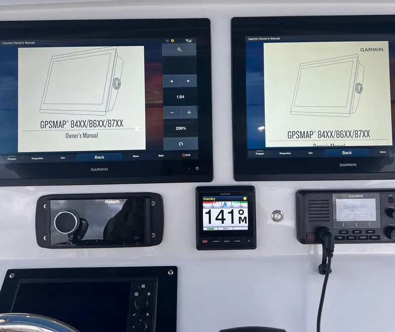 Slide: The Image of Intrepid 400 Center Console 2016 dashboard with Garmin GPSMAP displays and controls. - 20