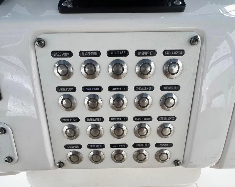 Slide: The Image of Control panel of a 2016 Intrepid 400 Center Console boat with labeled buttons. - 24