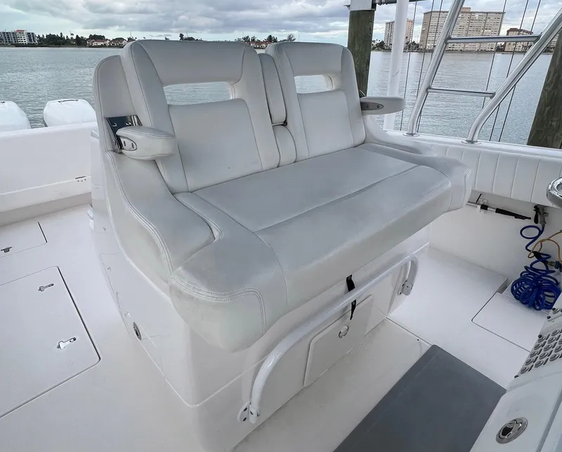Slide: The Image of 2016 Intrepid 400 Center Console boat seating with waterfront view. - 25