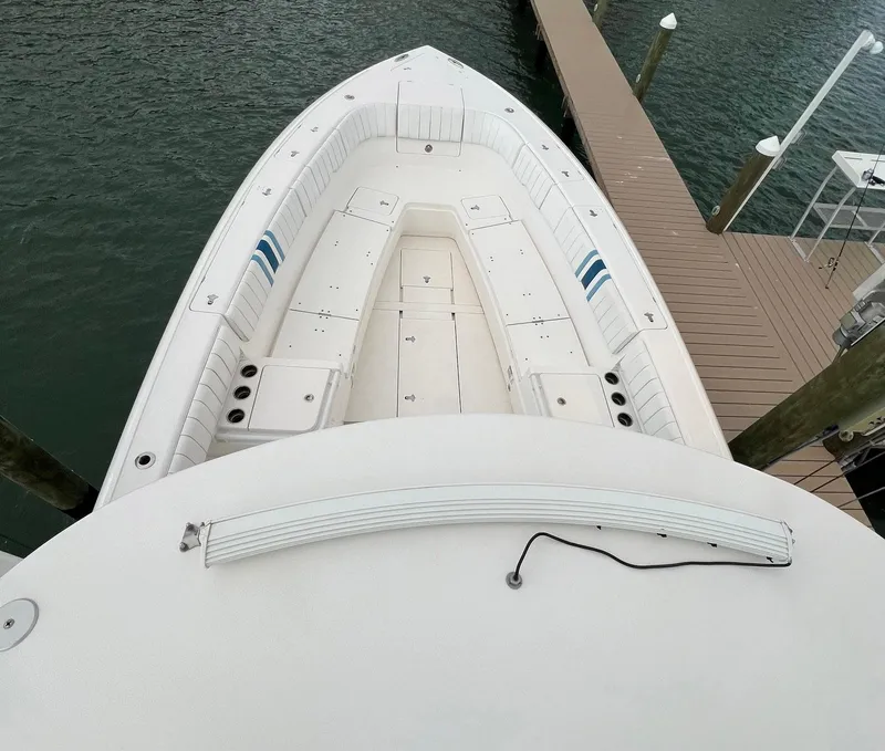 Slide: The Image of 2016 Intrepid 400 Center Console boat docked at marina. - 28