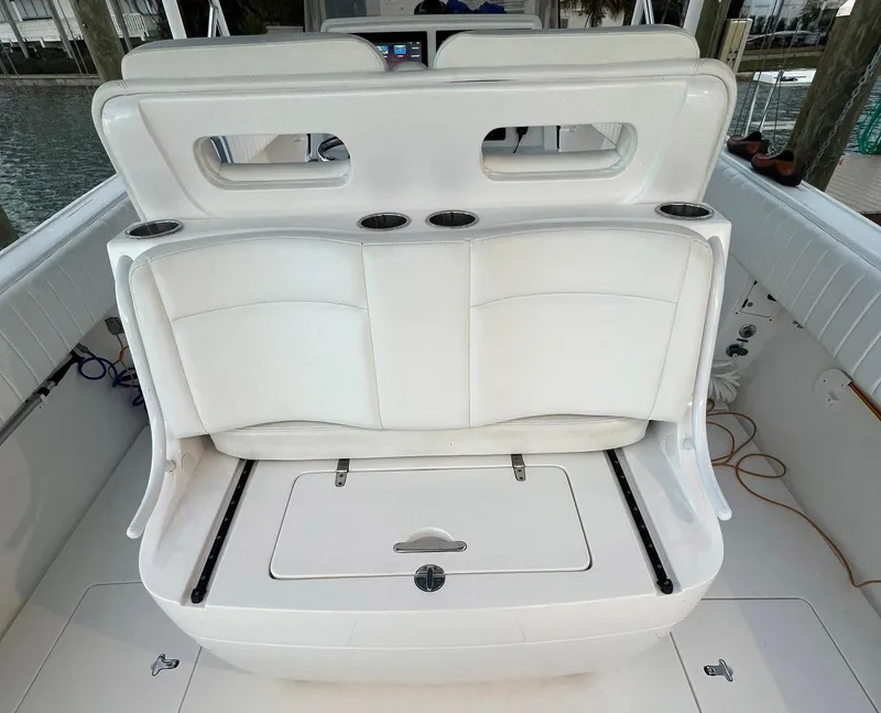 Slide: The Image of 2016 Intrepid 400 Center Console boat with white seating and storage compartment. - 32