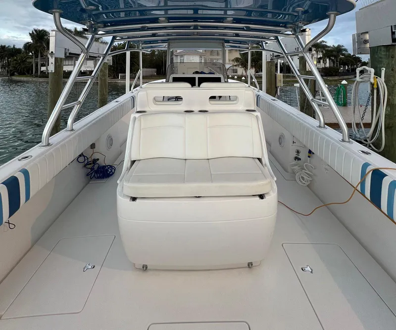 Slide: The Image of 2016 Intrepid 400 Center Console boat interior with seating and canopy. - 34