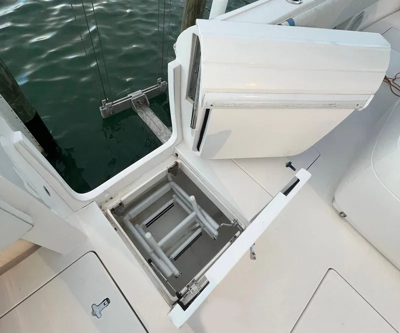 Slide: The Image of 2016 Intrepid 400 Center Console boat with open hatch and ladder. - 38