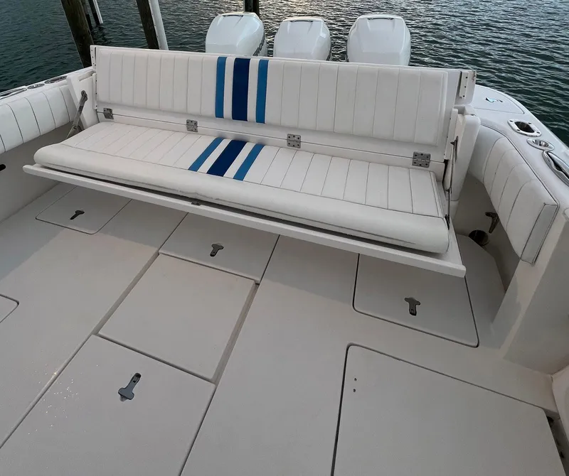 Slide: The Image of 2016 Intrepid 400 Center Console boat with white seating and blue accents. - 39