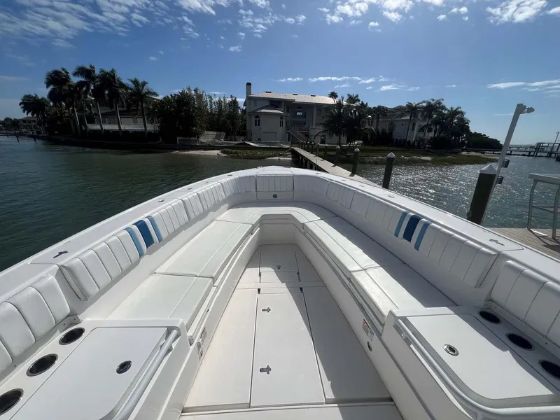 Slide: The Image of 2016 Intrepid 400 Center Console boat docked by waterfront home. - 4