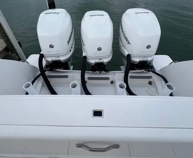 Slide: The Image of 2016 Intrepid 400 Center Console with triple Mercury outboard engines. - 41