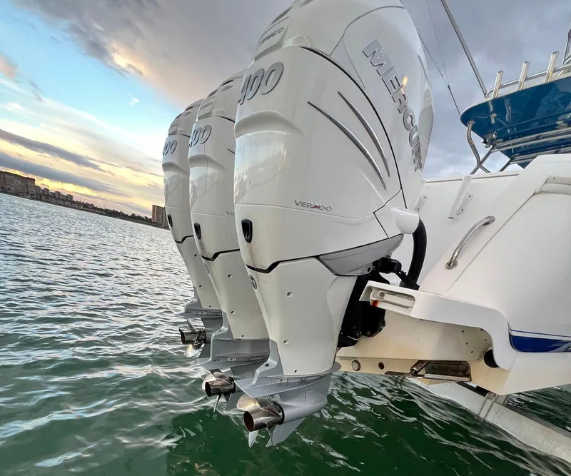 Slide: The Image of 2016 Intrepid 400 Center Console with triple Mercury outboard engines on water. - 43