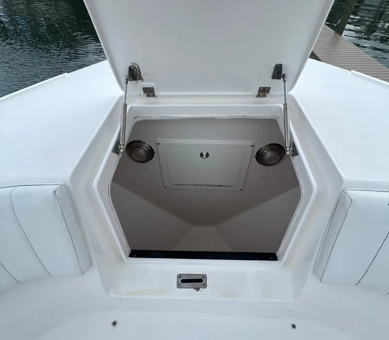 Slide: The Image of Open storage compartment on 2016 Intrepid 400 Center Console boat. - 5