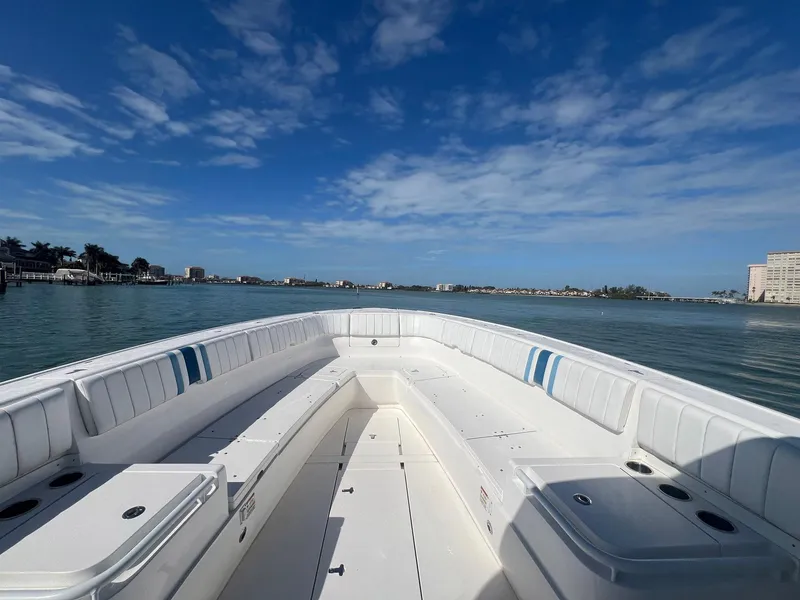 Slide: The Image of 2016 Intrepid 400 Center Console boat on calm water under blue sky. - 8