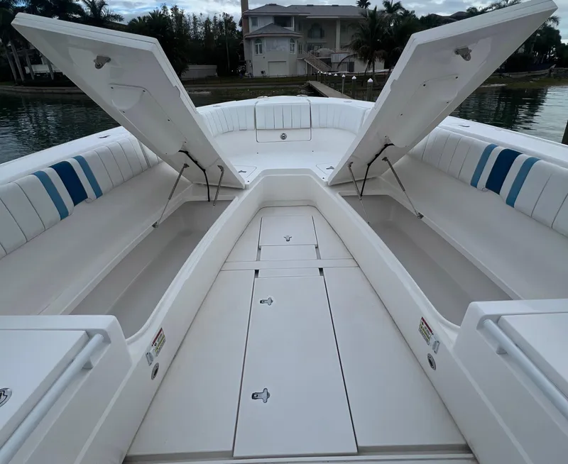 Slide: The Image of 2016 Intrepid 400 Center Console boat with open storage compartments. - 9