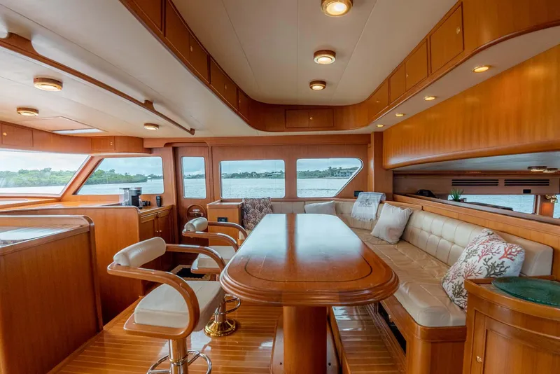 Slide: The Image of Luxurious interior of 2006 Marlow 72E LRC yacht with elegant wood finishes and comfortable seating. - 13