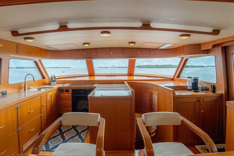 Slide: The Image of Luxurious interior of 2006 Marlow 72E LRC yacht with wooden flooring and modern furnishings. - 14