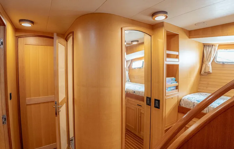 Slide: The Image of Luxurious interior of 2006 Marlow 72E LRC yacht with elegant wood finishes and comfortable seating. - 16