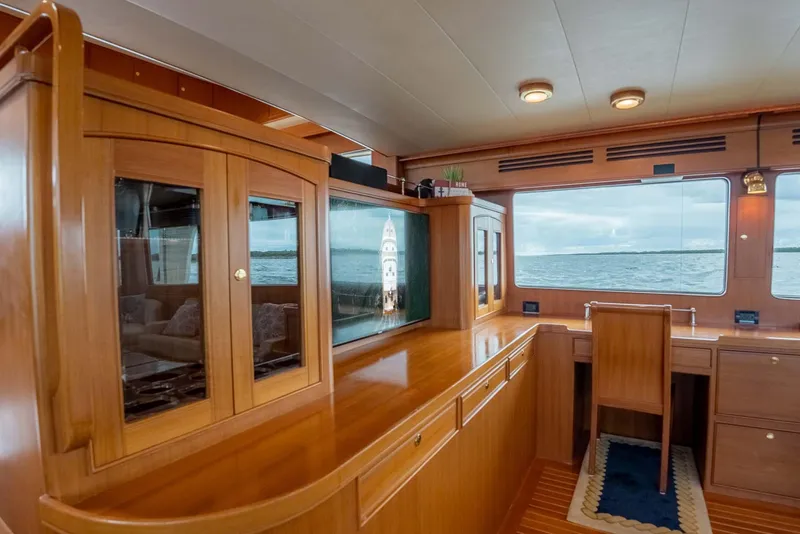Slide: The Image of Luxurious interior of 2006 Marlow 72E LRC yacht with elegant wood finishes and spacious seating. - 17
