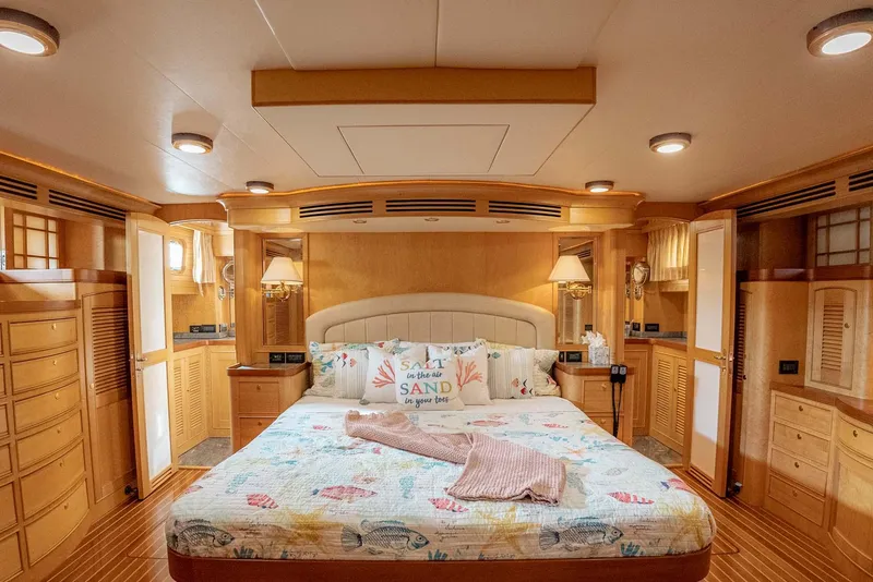 Slide: The Image of Luxurious interior of 2006 Marlow 72E LRC yacht with elegant wood finishes. - 18